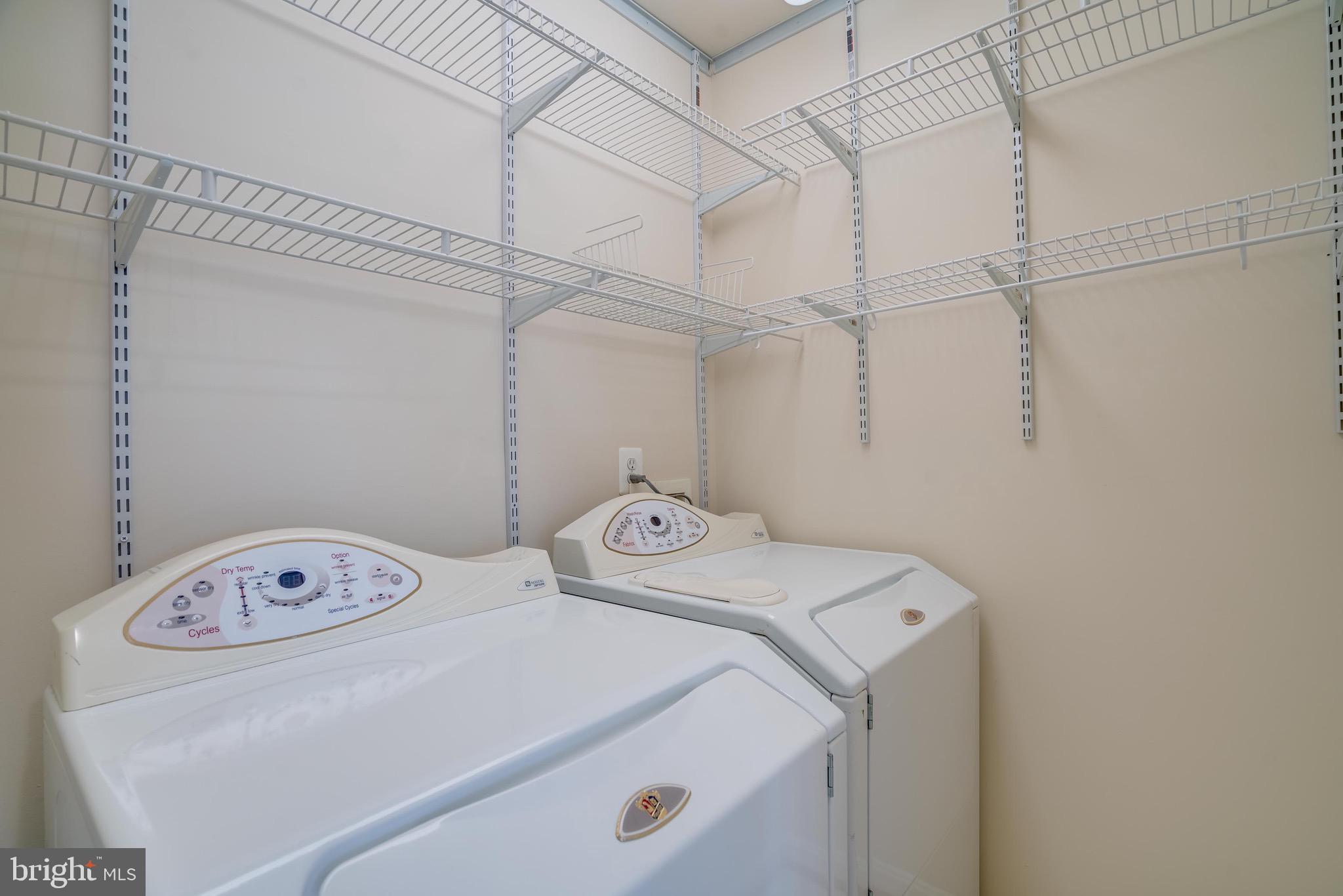 13641 Cedar Run Lane Herndon, VA 20171 - Photo 28 of 56 a utility room with dryer and washer