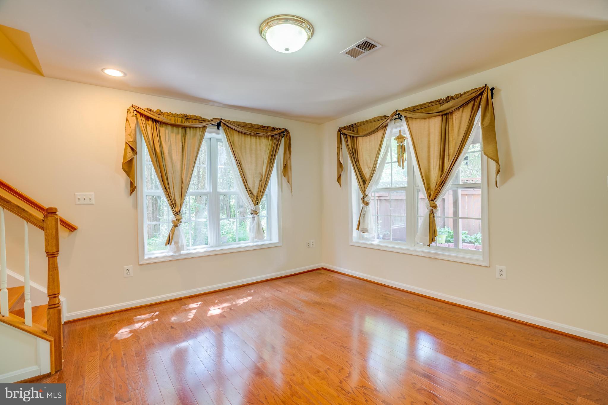 13641 Cedar Run Lane Herndon, VA 20171 - Photo 47 of 56 a view of an empty room with a window and wooden floor
