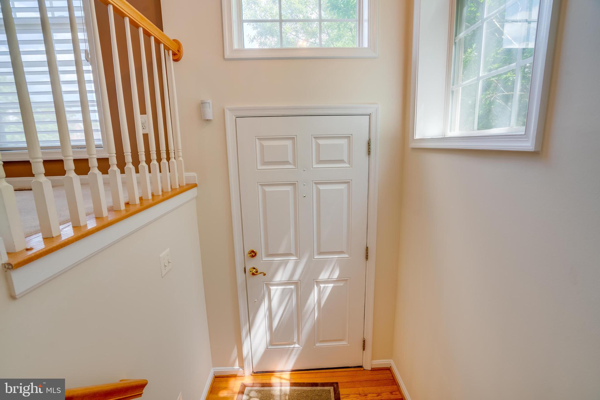 13641 Cedar Run Lane Herndon, VA 20171 - Photo 6 of 56 a view of front door with wooden floor