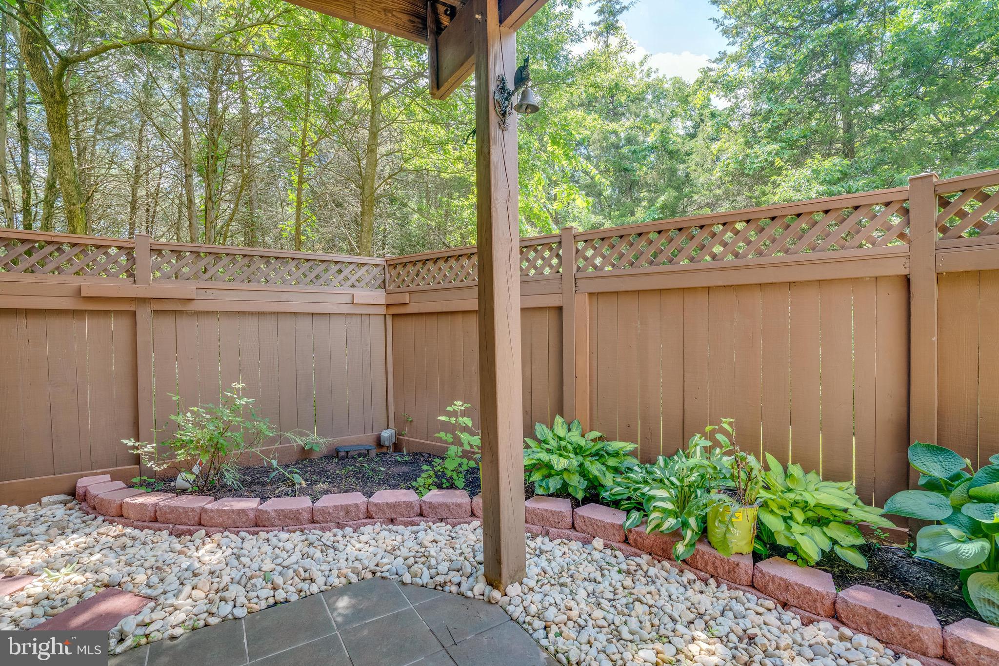 13641 Cedar Run Lane Herndon, VA 20171 - Photo 52 of 56 a view of a backyard with plants