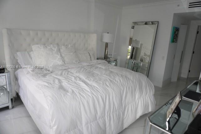 701 Brickell Key Boulevard, Unit 412 Miami, FL 33131 - Photo 26 of 37 a bedroom with a bed and a rug