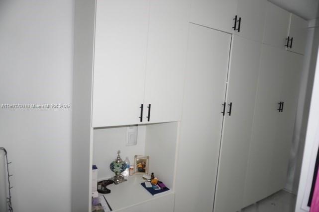 701 Brickell Key Boulevard, Unit 412 Miami, FL 33131 - Photo 33 of 37 a bathroom with a sink and vanity