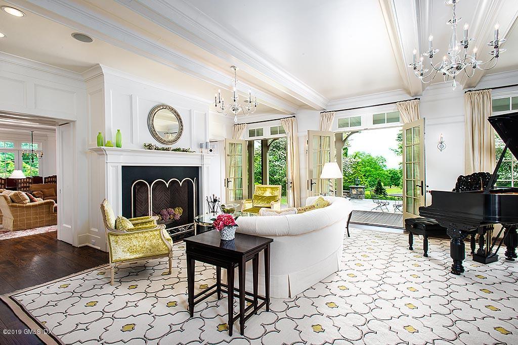 16 Doubling Road Greenwich, CT 06830 - Photo 11 of 45 a living room with furniture a table and a fireplace