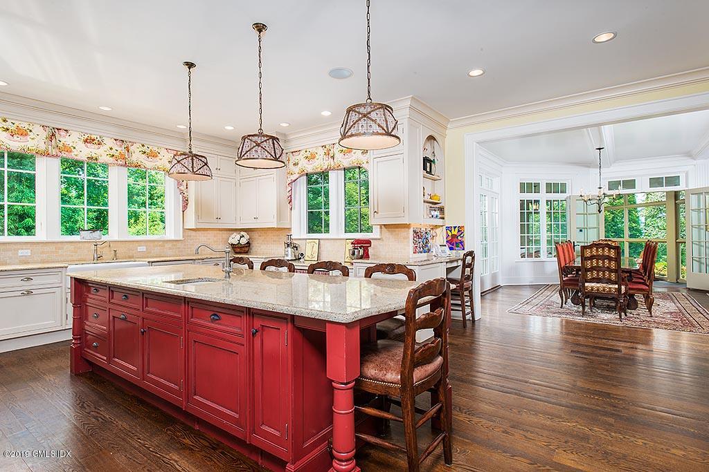 16 Doubling Road Greenwich, CT 06830 - Photo 15 of 45 a large kitchen with a large island in the center a sitting area