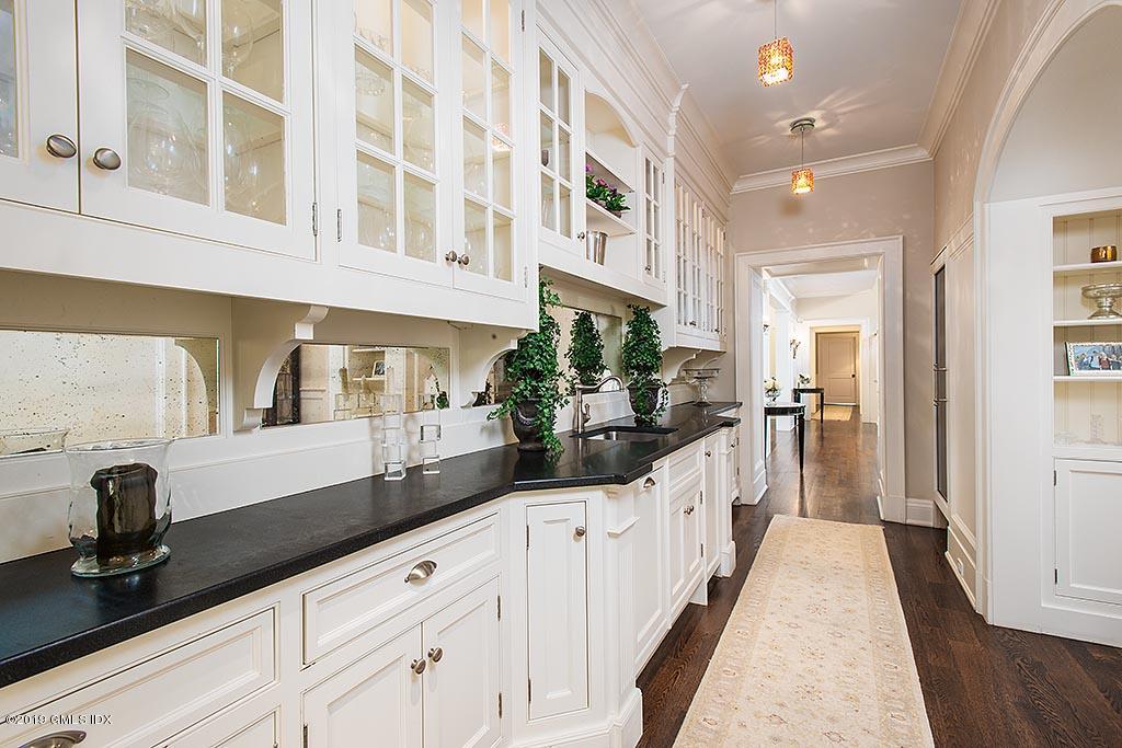 16 Doubling Road Greenwich, CT 06830 - Photo 17 of 45 a view of a kitchen with stainless steel appliances double vanity sink and wooden floor