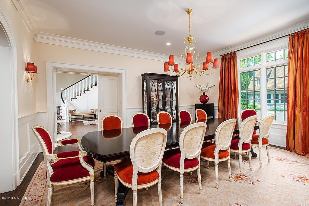 16 Doubling Road Greenwich, CT 06830 - Photo 18 of 45 a dining room with furniture a chandelier and wooden floor