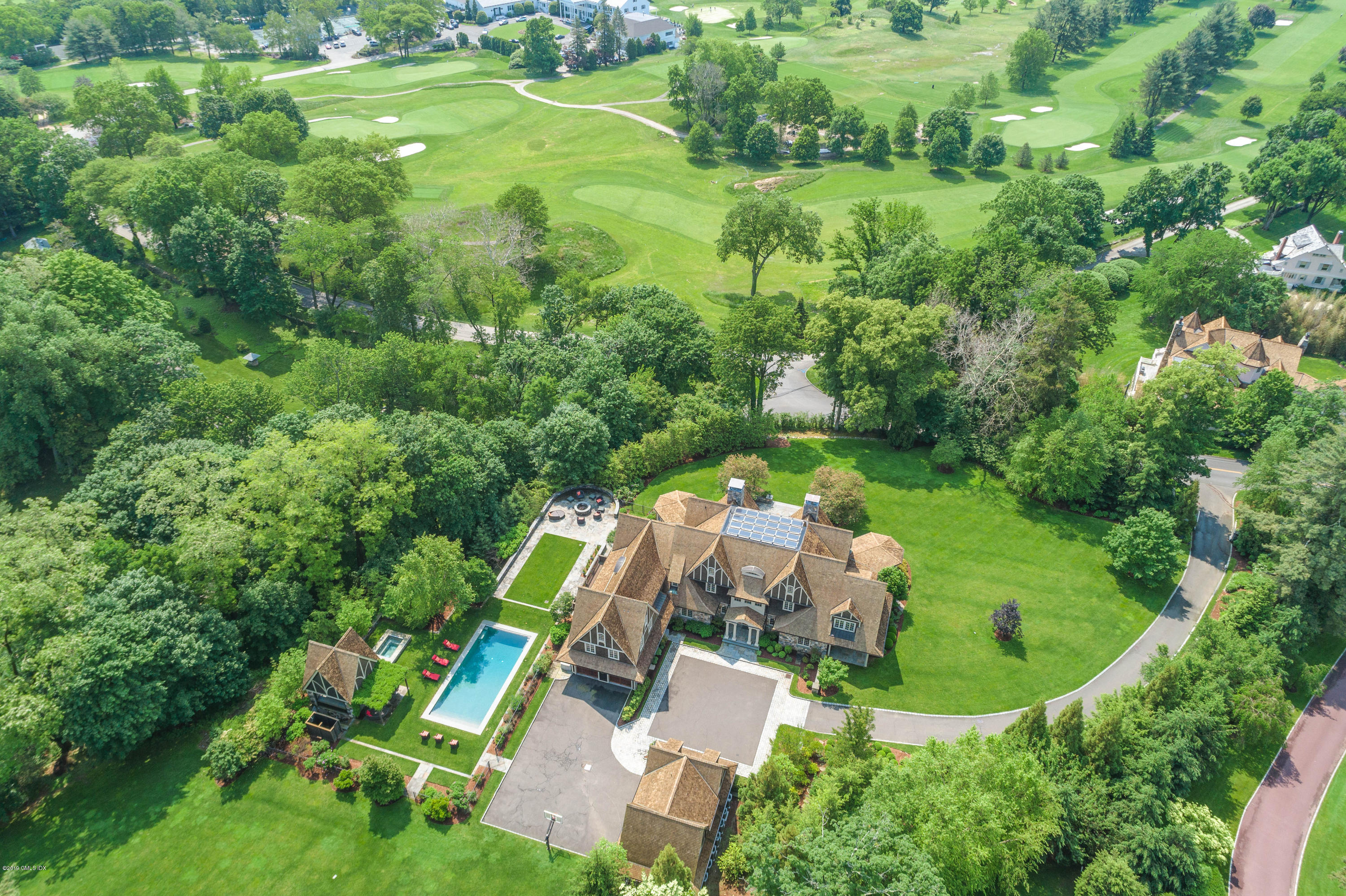 16 Doubling Road Greenwich, CT 06830 - Photo 2 of 45 an aerial view of residential house with outdoor space and trees all around