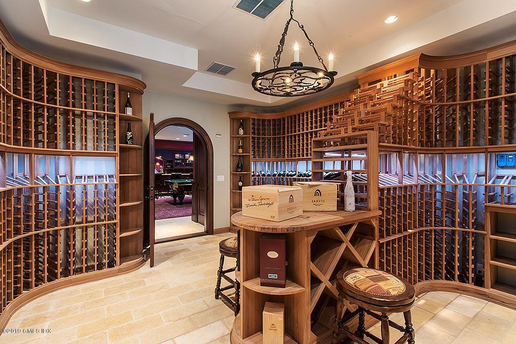 16 Doubling Road Greenwich, CT 06830 - Photo 22 of 45 a view of a dining table and chairs in the patio