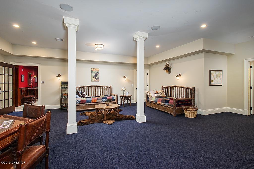 16 Doubling Road Greenwich, CT 06830 - Photo 24 of 45 a bedroom with furniture and a large window