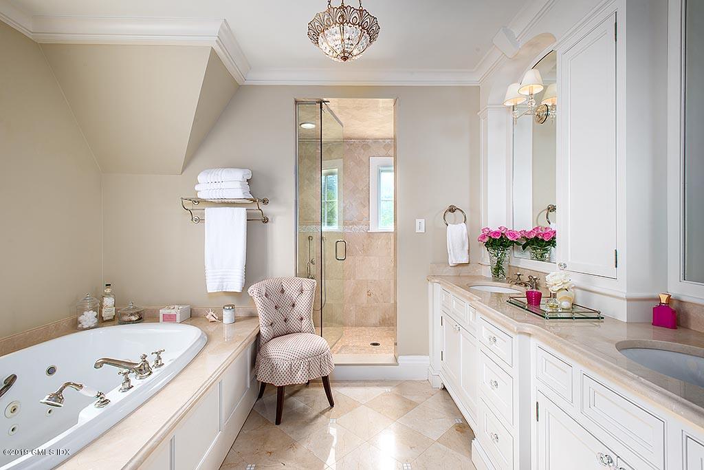 16 Doubling Road Greenwich, CT 06830 - Photo 27 of 45 a spacious bathroom with a tub sink and a mirror