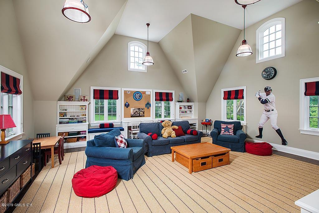 16 Doubling Road Greenwich, CT 06830 - Photo 29 of 45 a living room with furniture kitchen view and a wooden floor