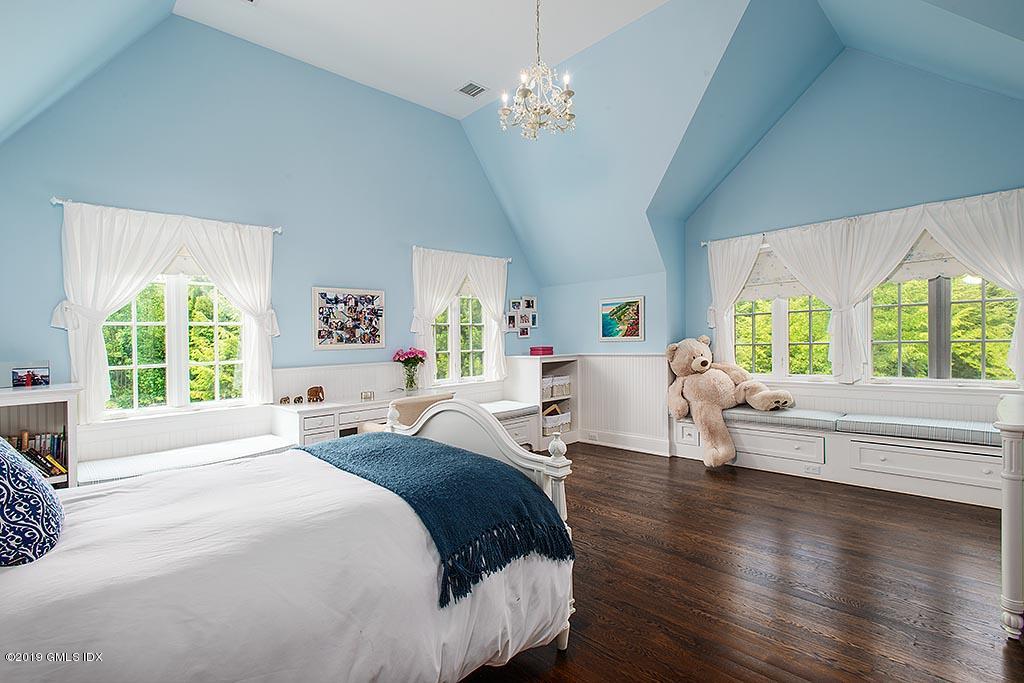 16 Doubling Road Greenwich, CT 06830 - Photo 30 of 45 a bed room with a bed and a large window
