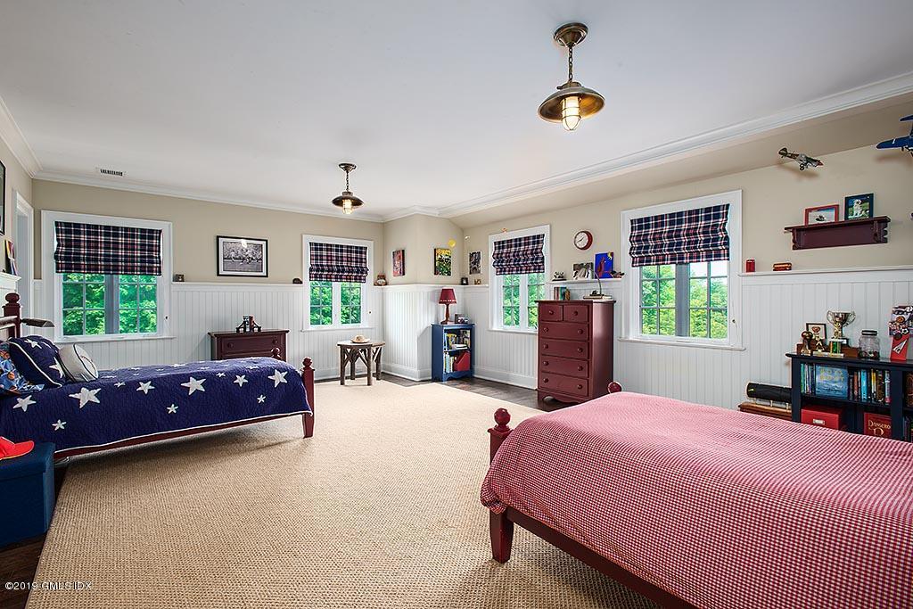 16 Doubling Road Greenwich, CT 06830 - Photo 32 of 45 a bedroom with a bed and a window