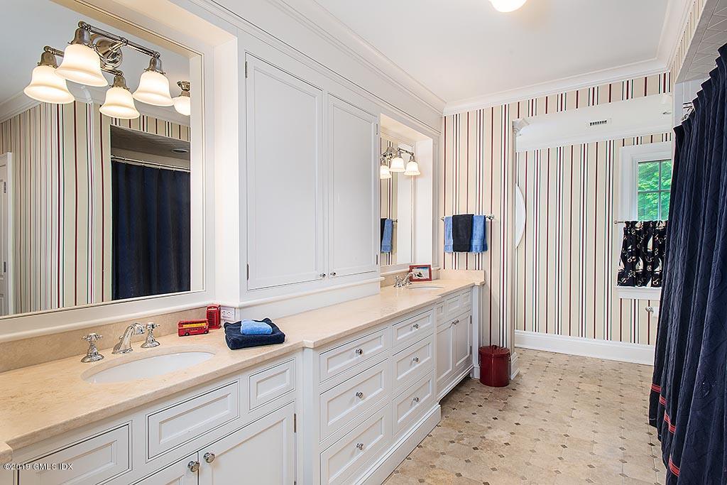 16 Doubling Road Greenwich, CT 06830 - Photo 33 of 45 a bathroom with a double vanity sink mirror and double