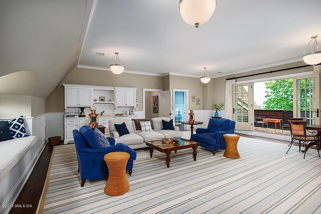 16 Doubling Road Greenwich, CT 06830 - Photo 34 of 45 a living room with furniture and a large window