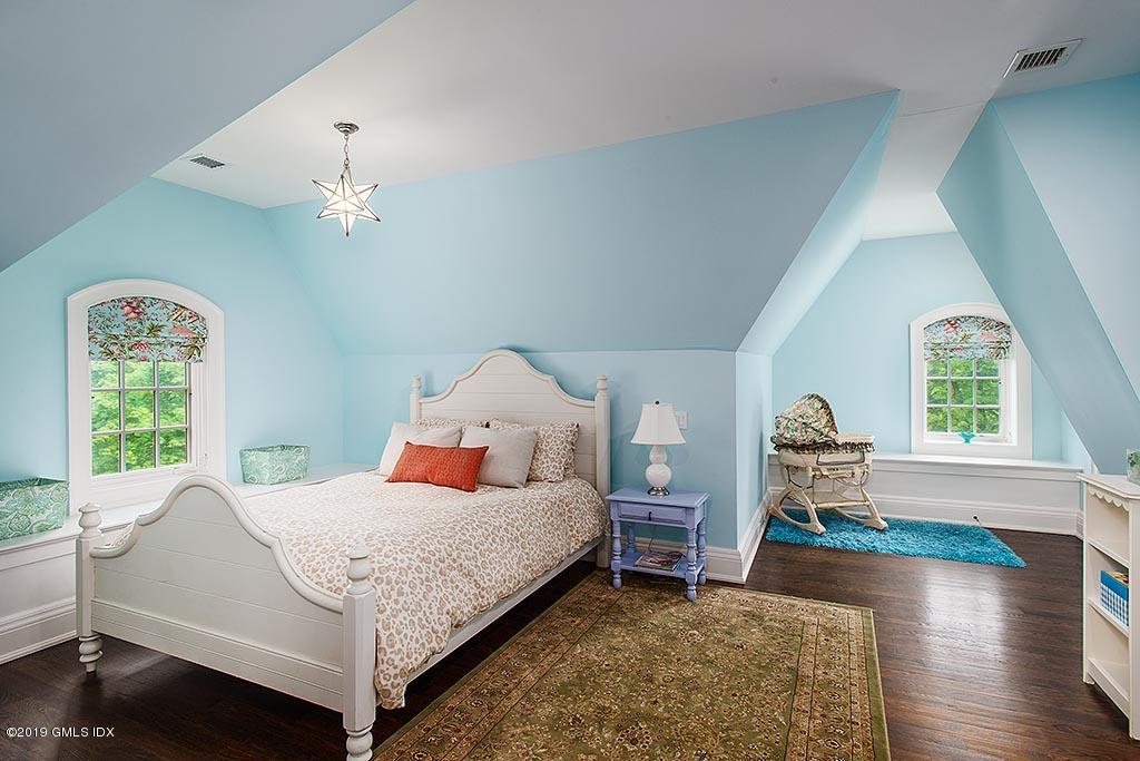 16 Doubling Road Greenwich, CT 06830 - Photo 36 of 45 a bedroom with a bed and a window