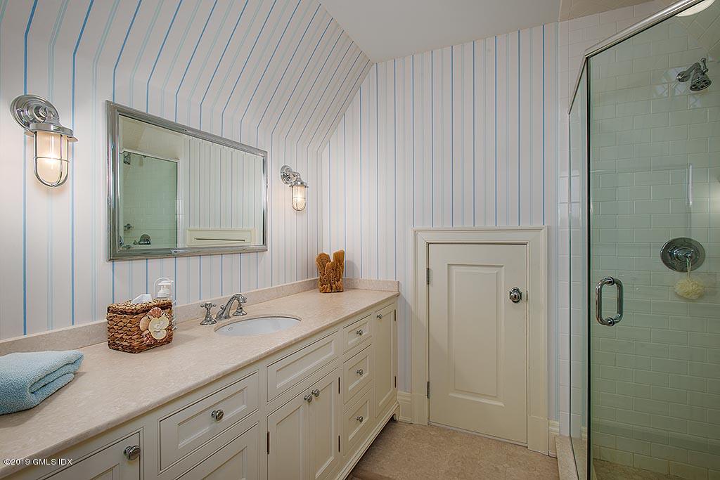 16 Doubling Road Greenwich, CT 06830 - Photo 37 of 45 a bathroom with a granite countertop sink and a mirror