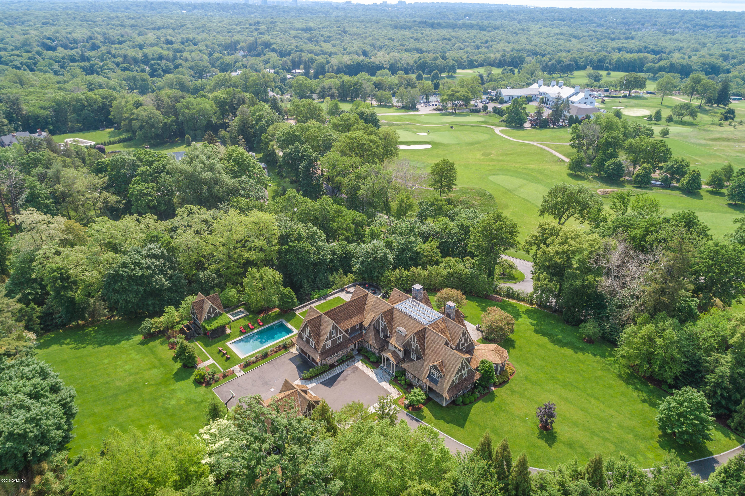 16 Doubling Road Greenwich, CT 06830 - Photo 38 of 45 an aerial view of residential house with outdoor space and trees all around