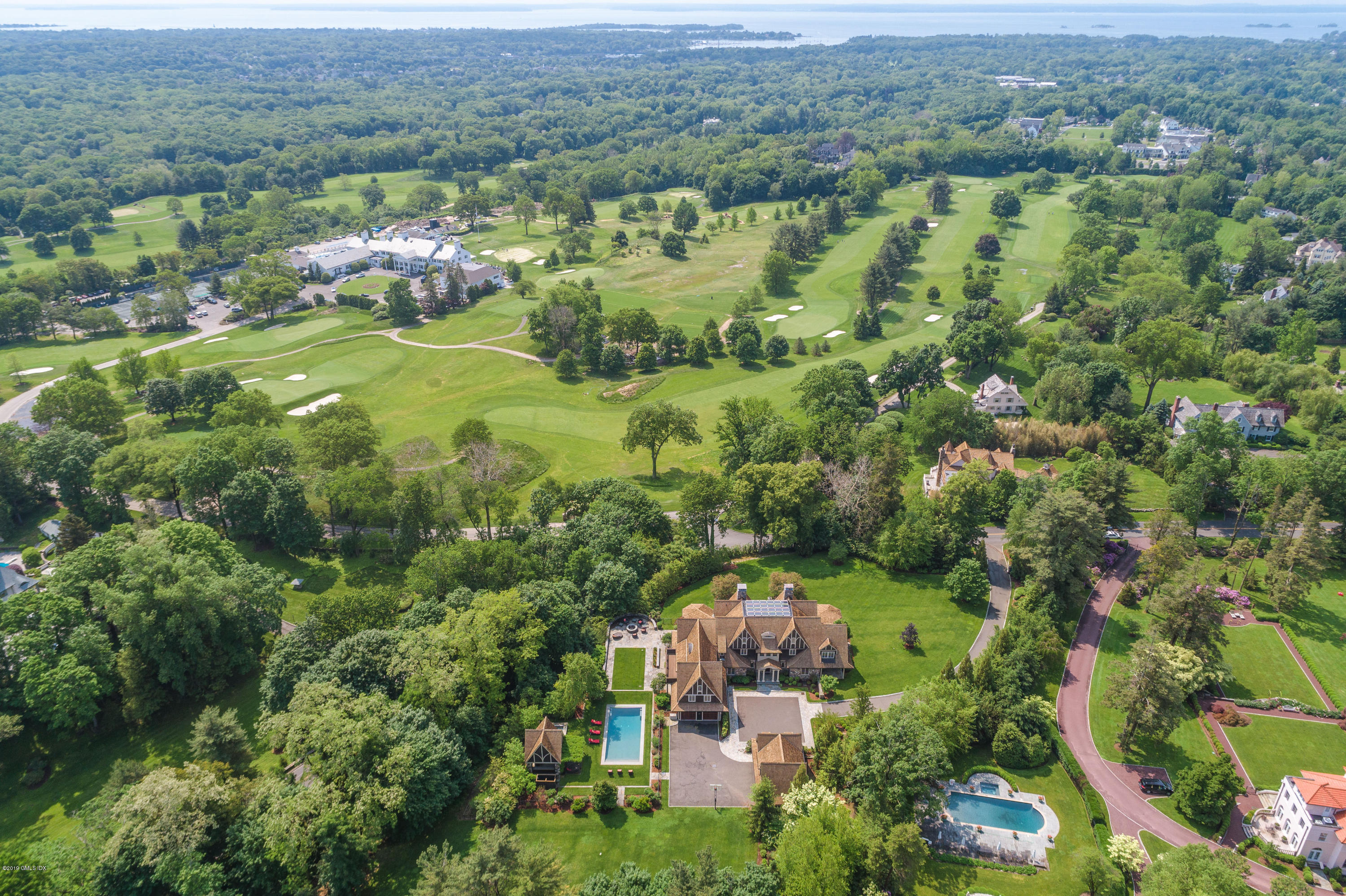 16 Doubling Road Greenwich, CT 06830 - Photo 39 of 45 an aerial view of a house with a yard