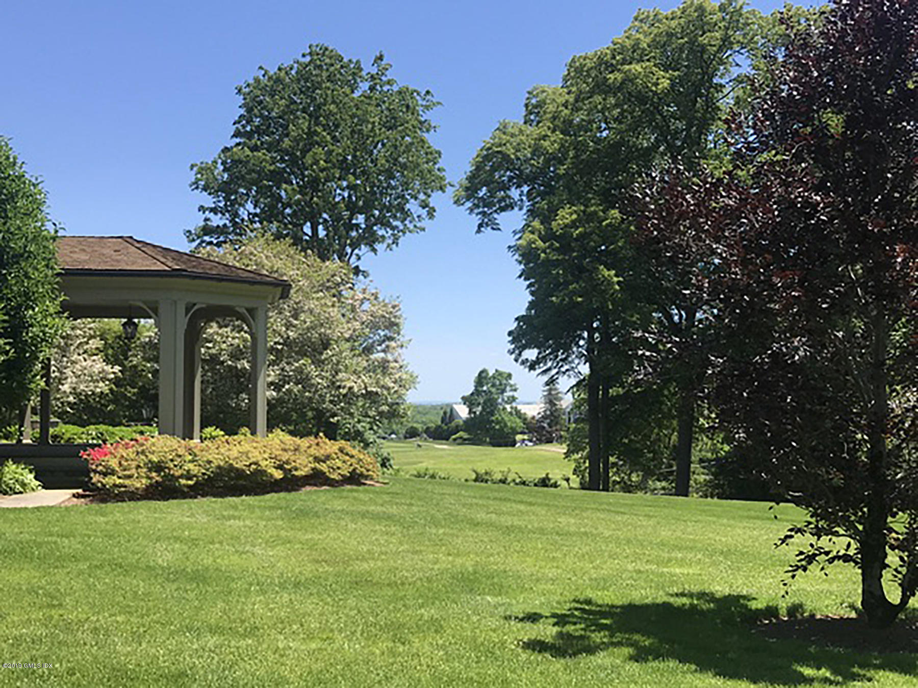 16 Doubling Road Greenwich, CT 06830 - Photo 41 of 45 a front view of a house with garden