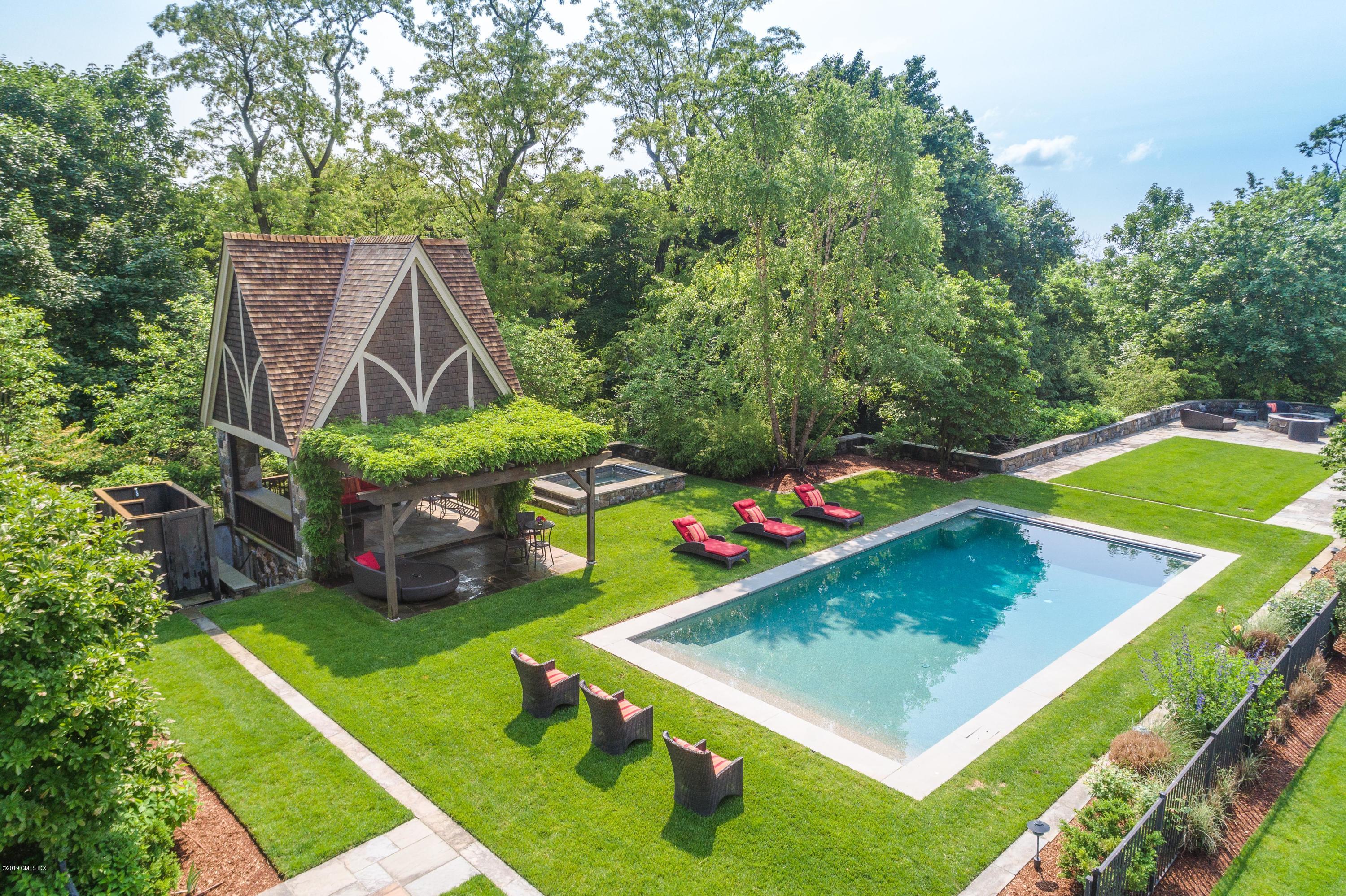 16 Doubling Road Greenwich, CT 06830 - Photo 6 of 45 a view of a backyard with sitting area and slide