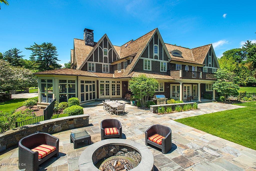 16 Doubling Road Greenwich, CT 06830 - Photo 7 of 45 a front view of house with yard space and patio