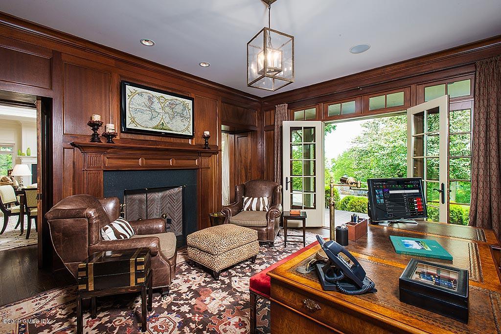 16 Doubling Road Greenwich, CT 06830 - Photo 10 of 45 a living room with furniture fireplace and a large window