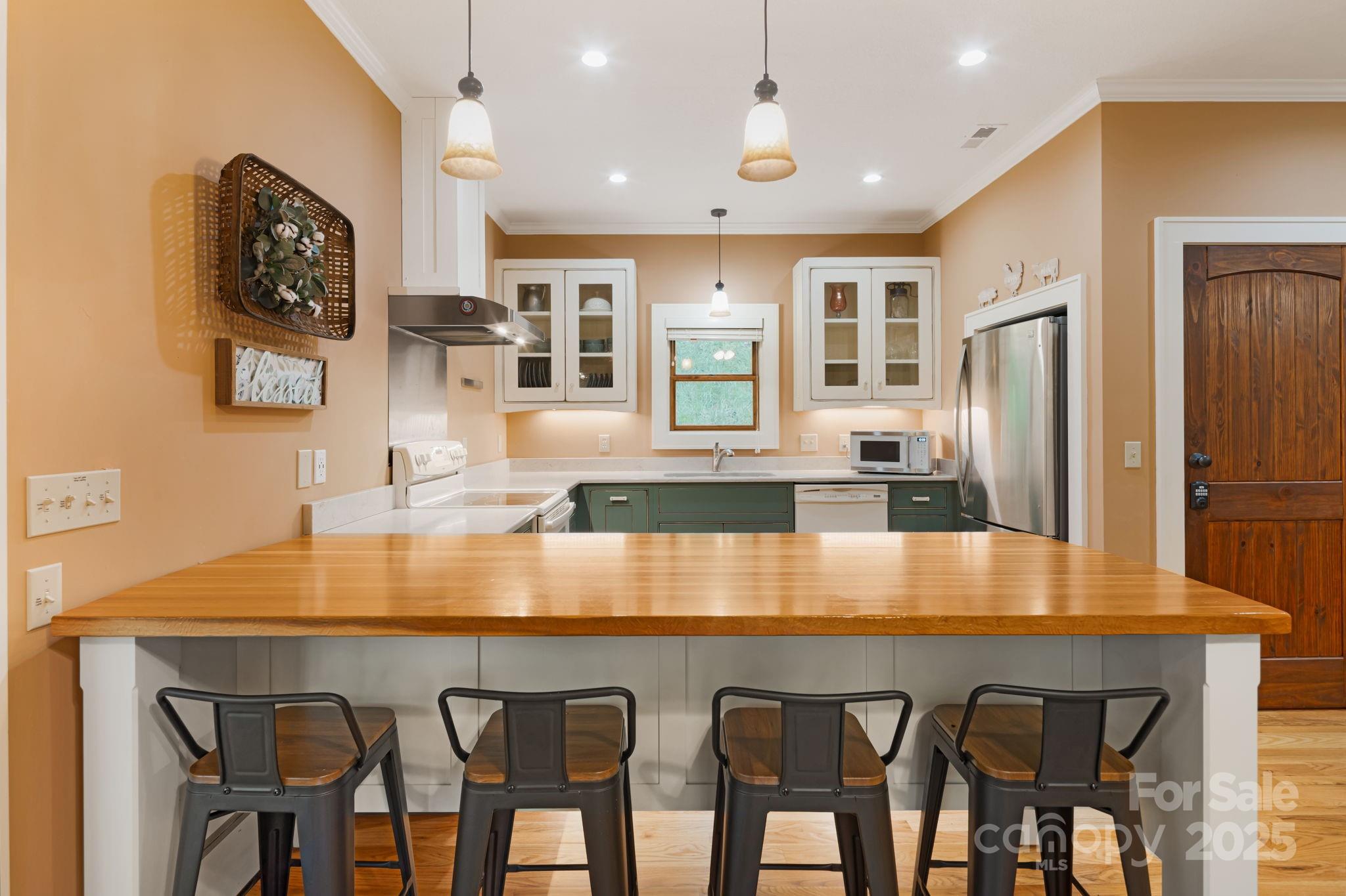 79 Slumber Lane Sylva, NC 28779 - Photo 11 of 29 a dining table with chairs and wooden floor