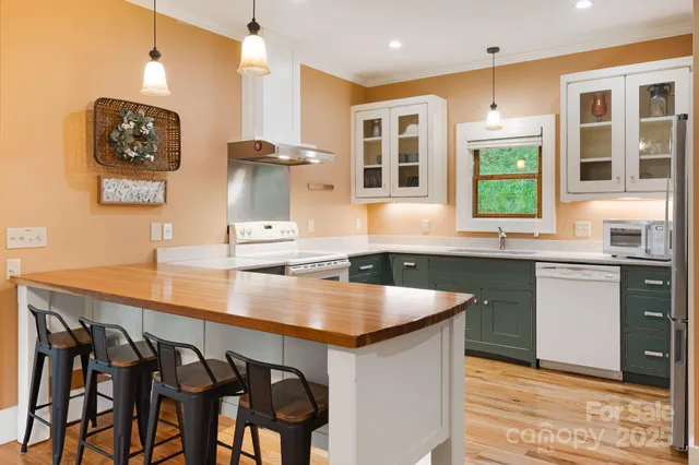 a kitchen with a sink cabinets and window