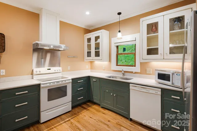 a kitchen with stainless steel appliances granite countertop a stove and sink