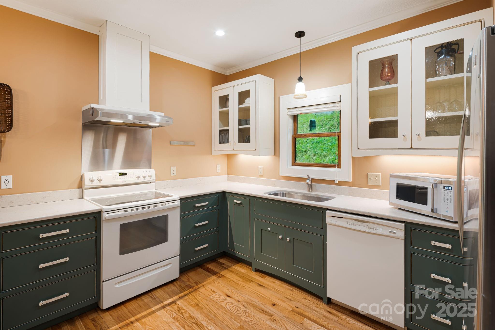 79 Slumber Lane Sylva, NC 28779 - Photo 13 of 29 a kitchen with stainless steel appliances granite countertop a stove and sink