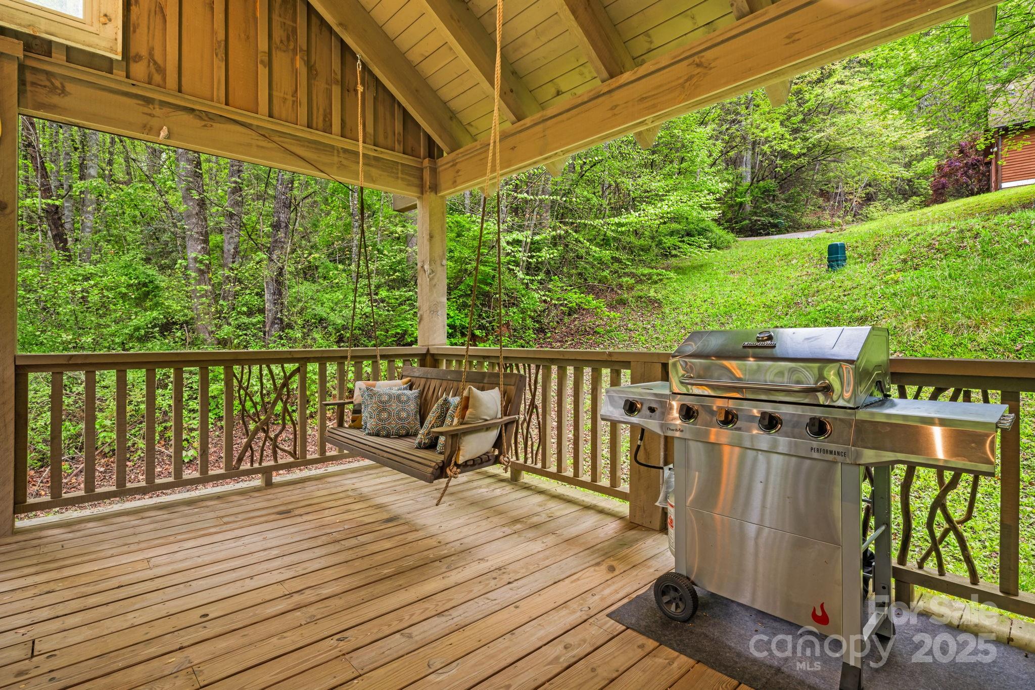 79 Slumber Lane Sylva, NC 28779 - Photo 20 of 29 a view of a balcony with wooden floor and outdoor seating