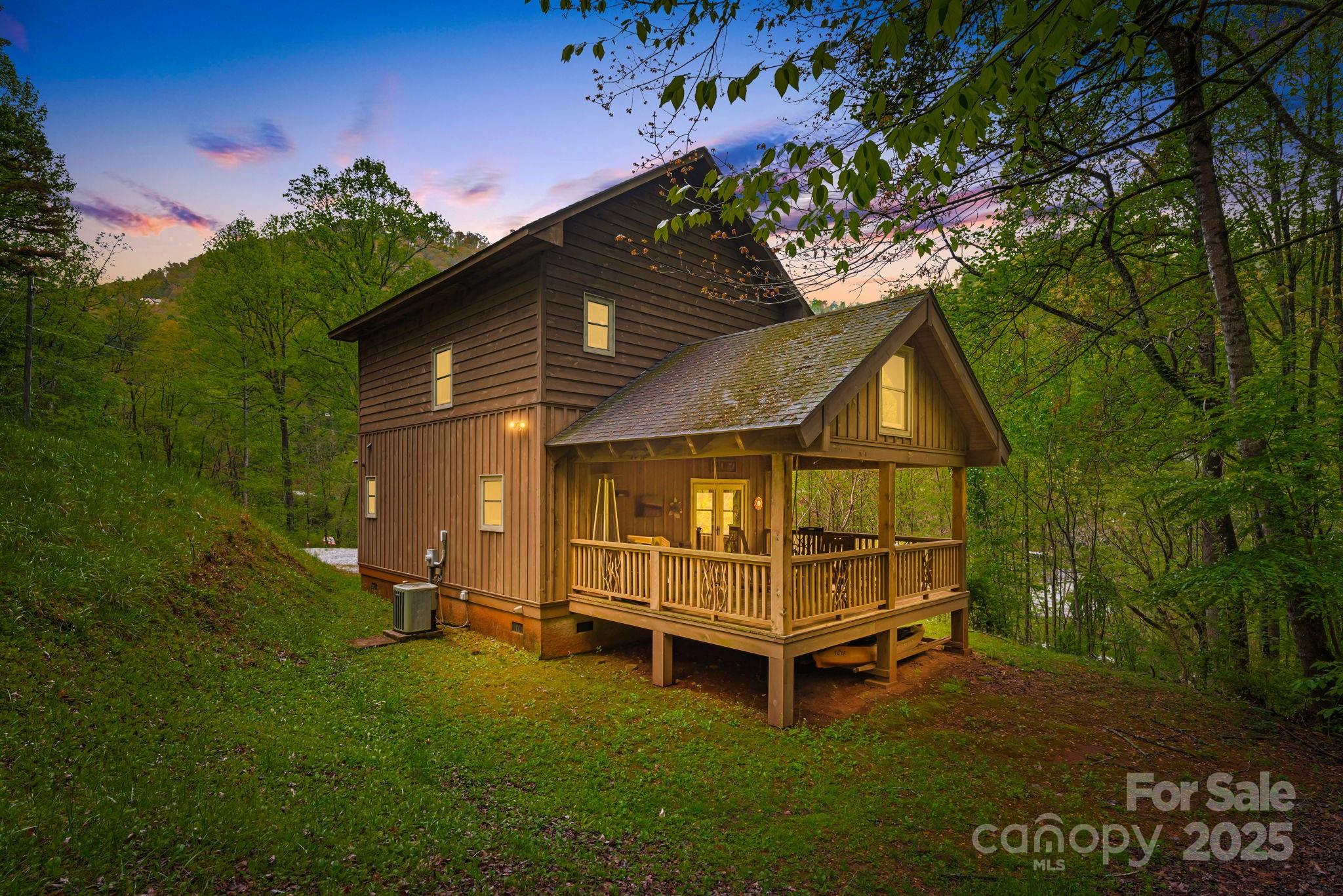 79 Slumber Lane Sylva, NC 28779 - Photo 2 of 29 a view of backyard with a garden and deck