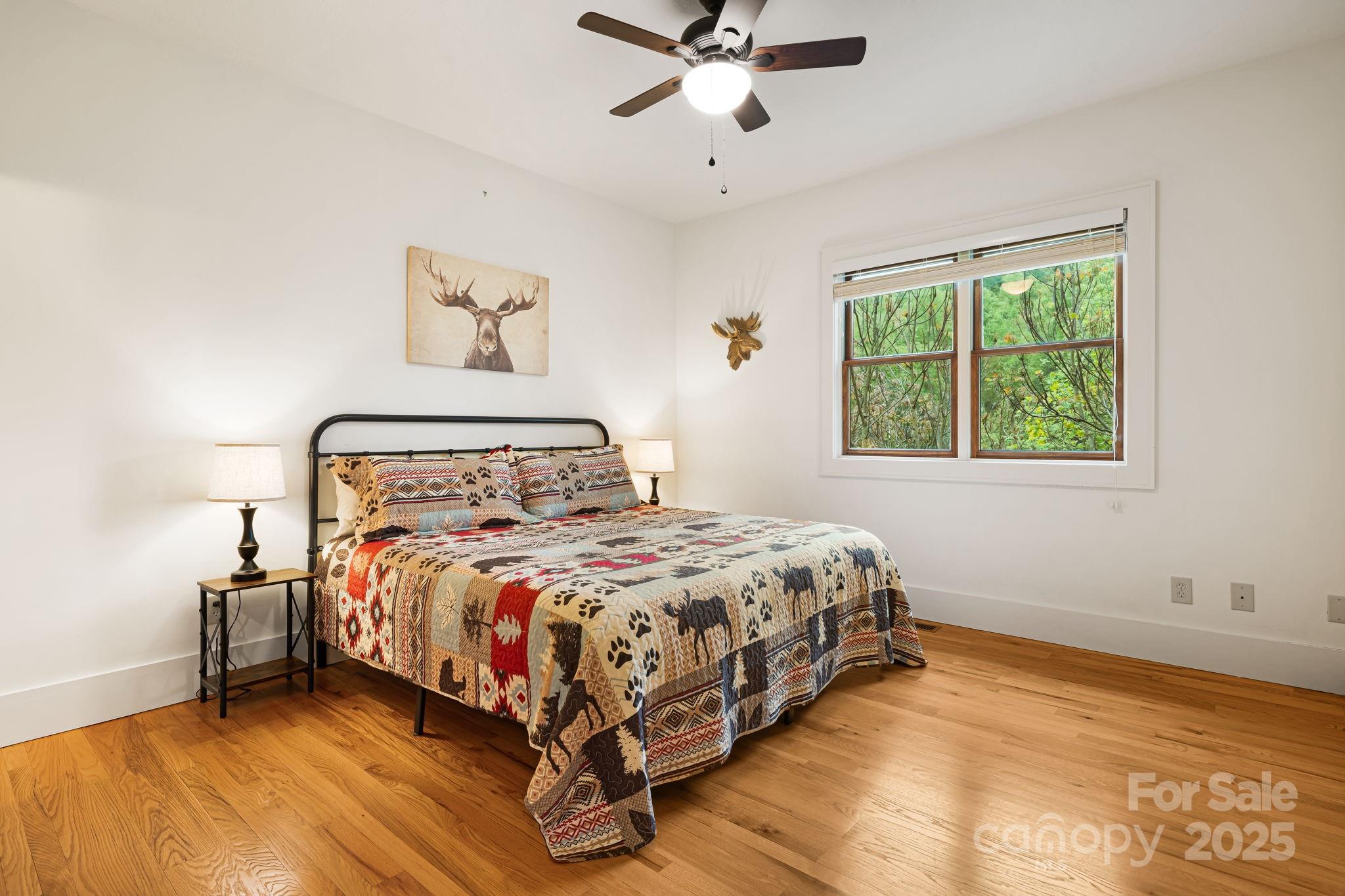 79 Slumber Lane Sylva, NC 28779 - Photo 21 of 29 a bedroom with a bed and window