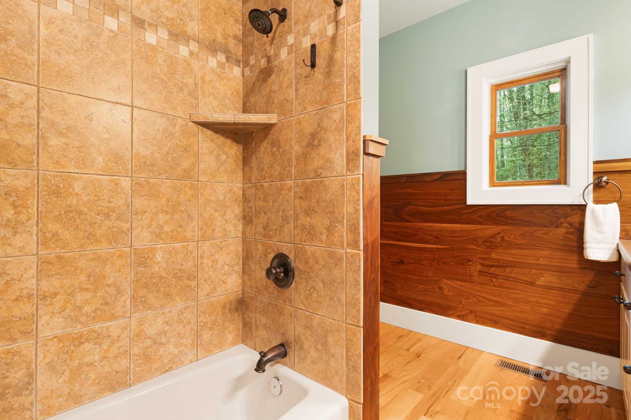 79 Slumber Lane Sylva, NC 28779 - Photo 26 of 29 a bathroom with a bathtub and shower