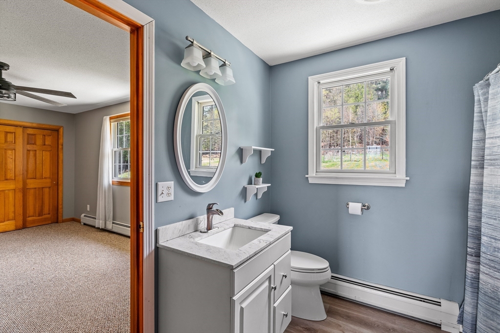 574 Main Road Chesterfield, MA 01012 - Photo 30 of 42 a bathroom with a toilet a sink and a mirror