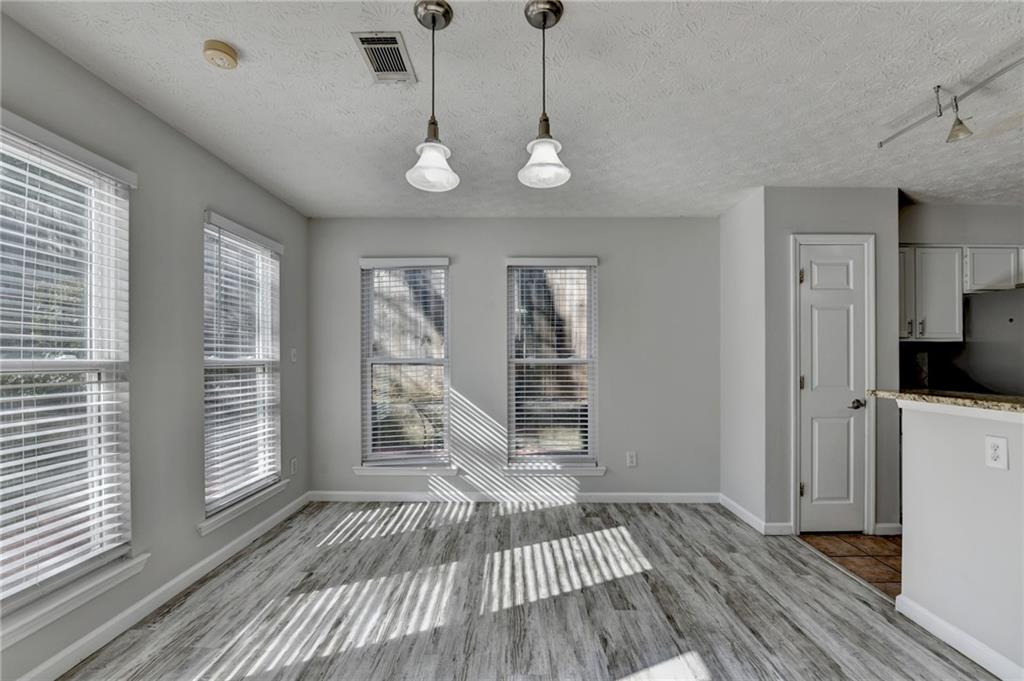 1112 Ashbury Drive Decatur, GA 30030 - Photo 19 of 64 a view of a room with wooden floor and a window