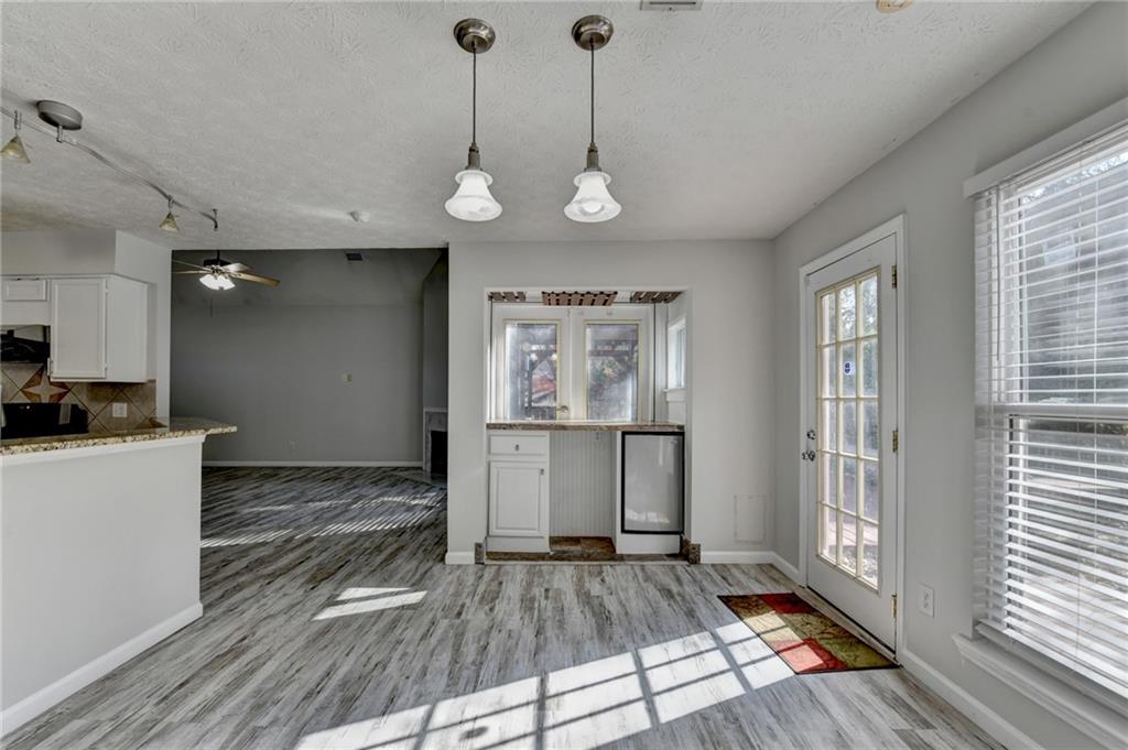 1112 Ashbury Drive Decatur, GA 30030 - Photo 21 of 64 a view of a kitchen with a stove cabinets and wooden floor