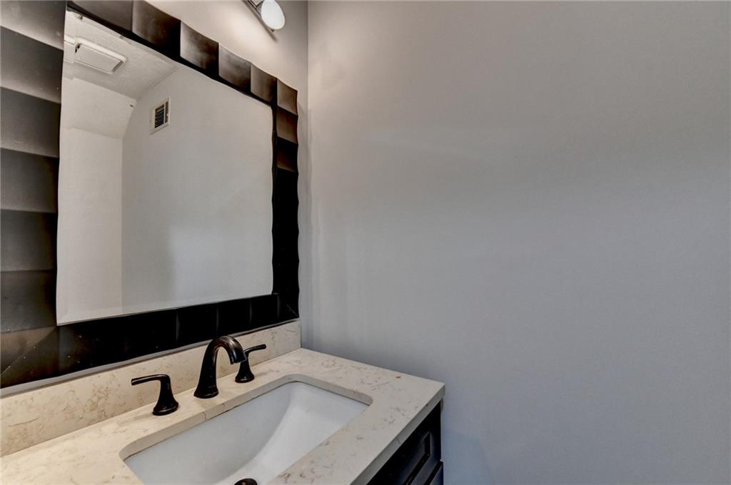 1112 Ashbury Drive Decatur, GA 30030 - Photo 32 of 64 a bathroom with a sink and a mirror