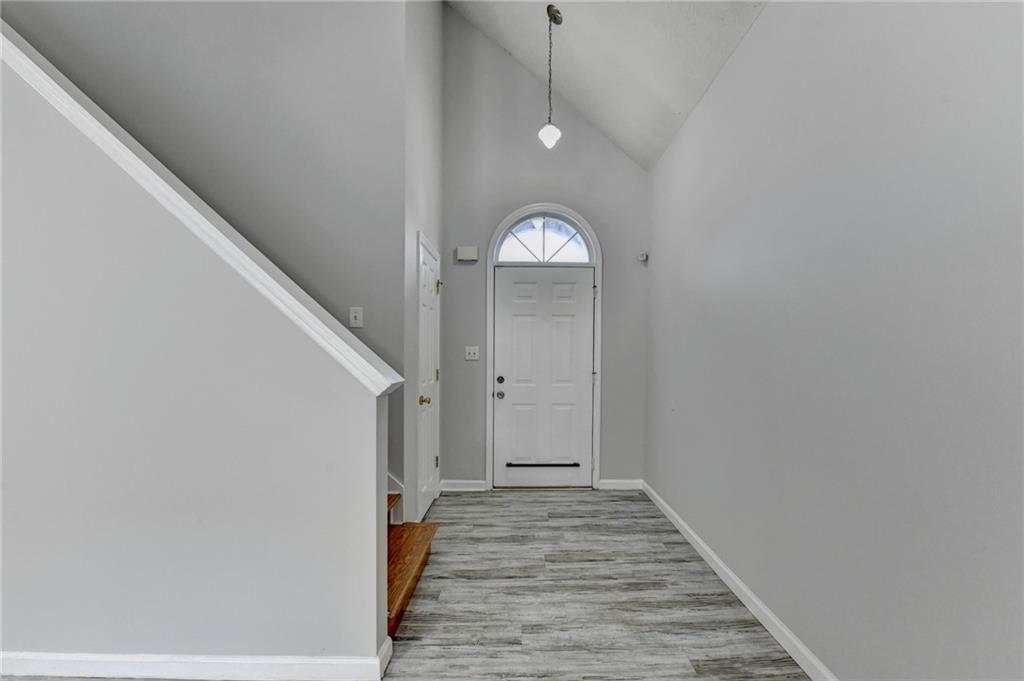 1112 Ashbury Drive Decatur, GA 30030 - Photo 33 of 64 a view of a hallway with wooden floor and staircase