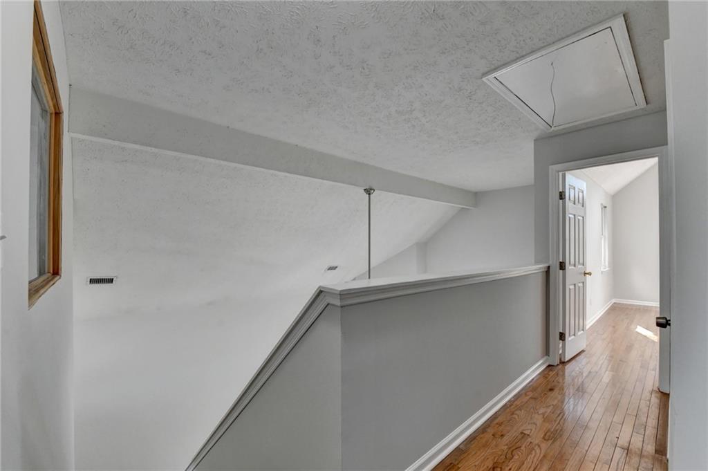 1112 Ashbury Drive Decatur, GA 30030 - Photo 35 of 64 a view of a kitchen with wooden floor and staircase