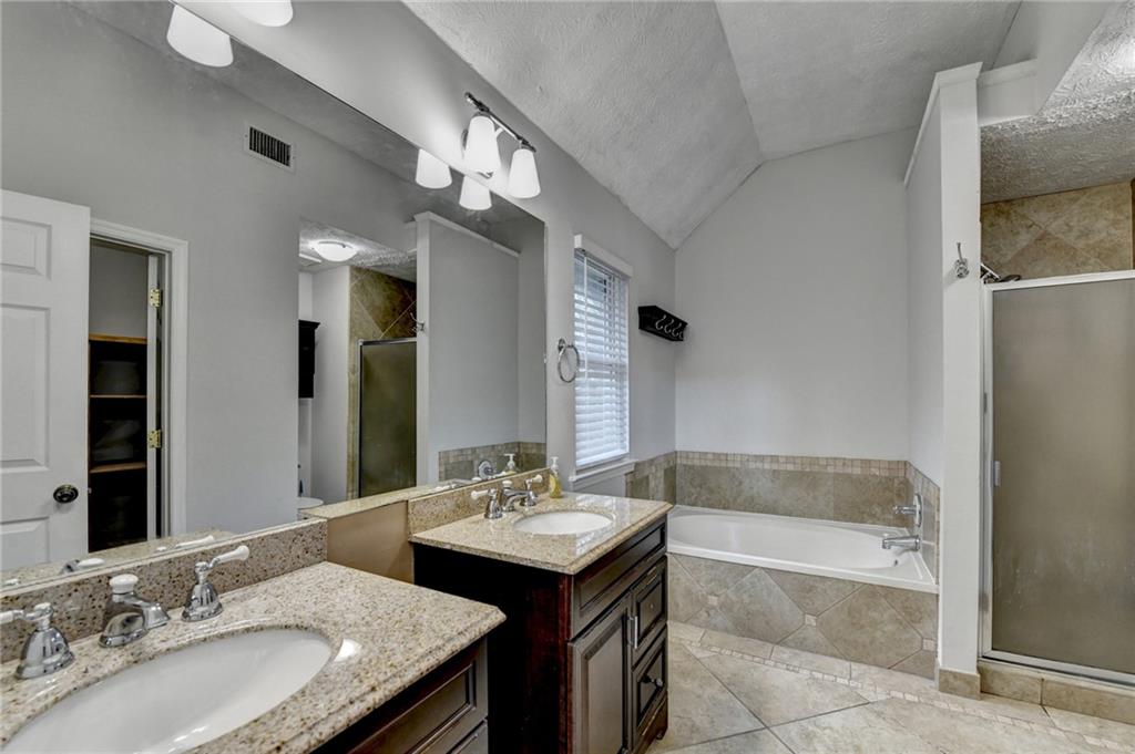 1112 Ashbury Drive Decatur, GA 30030 - Photo 51 of 64 a bathroom with a granite countertop sink and a mirror