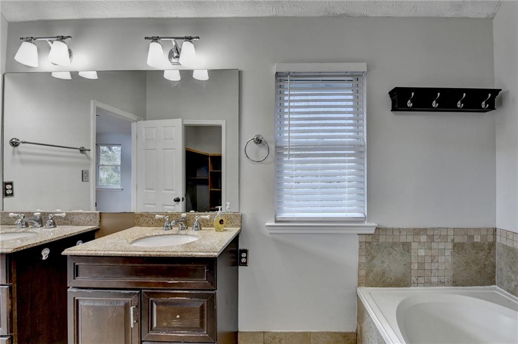 1112 Ashbury Drive Decatur, GA 30030 - Photo 53 of 64 a bathroom with a sink and a mirror