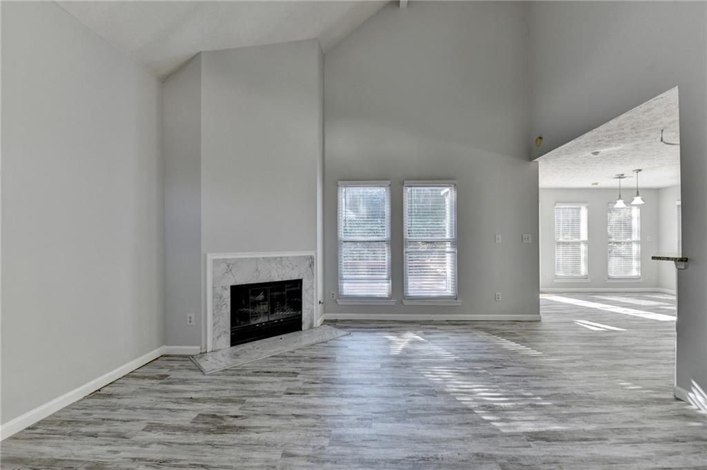 1112 Ashbury Drive Decatur, GA 30030 - Photo 9 of 64 a view of an empty room with wooden floor and a window