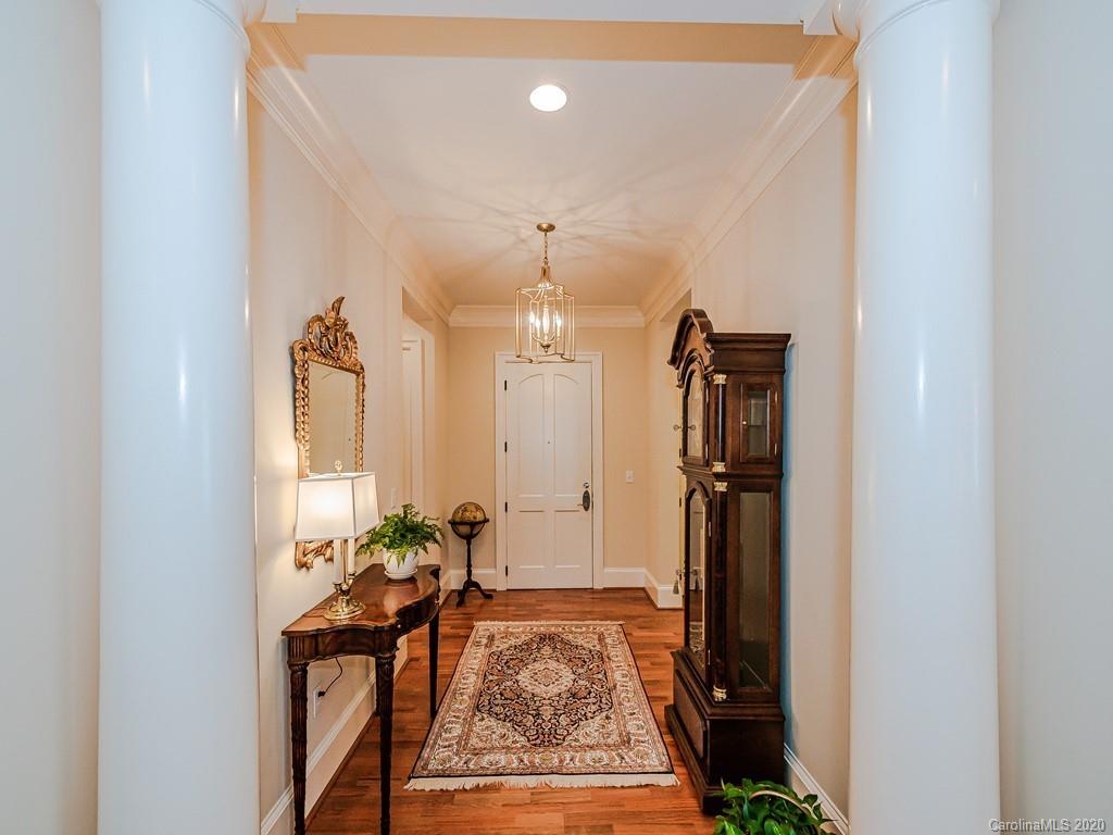 2223 Croydon Road, Unit 204 Charlotte, NC 28207 - Photo 3 of 27 a very nice looking room with a large mirror and a potted plant