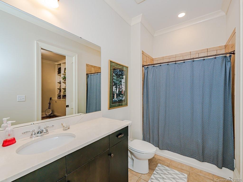 2223 Croydon Road, Unit 204 Charlotte, NC 28207 - Photo 21 of 27 a bathroom with a sink and a mirror