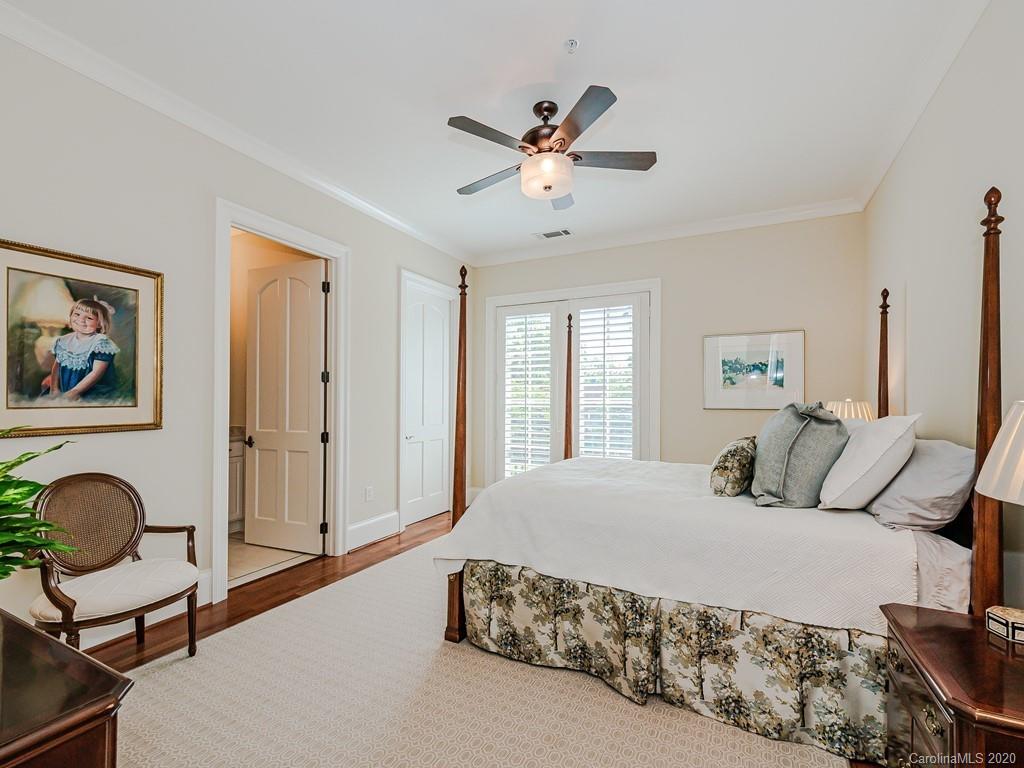 2223 Croydon Road, Unit 204 Charlotte, NC 28207 - Photo 22 of 27 a bedroom with a large bed and furniture