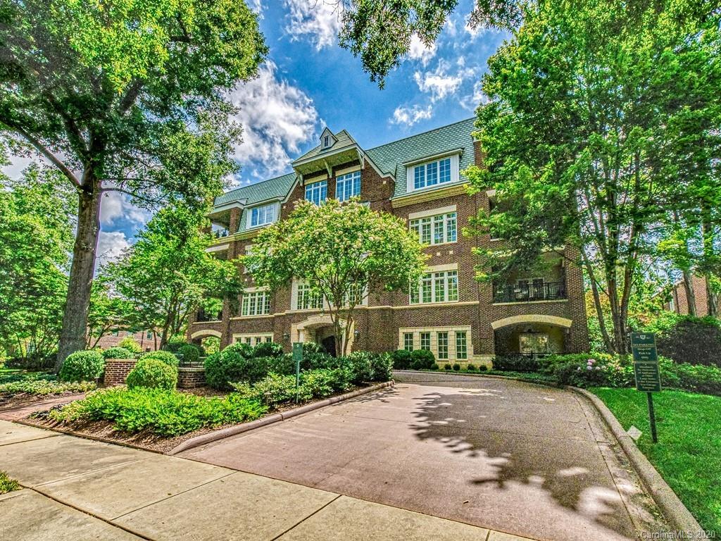 2223 Croydon Road, Unit 204 Charlotte, NC 28207 - Photo 27 of 27 a front view of a house with a garden and trees