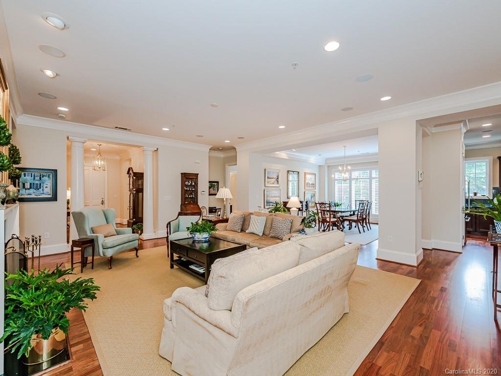 2223 Croydon Road, Unit 204 Charlotte, NC 28207 - Photo 6 of 27 a living room with furniture and wooden floor
