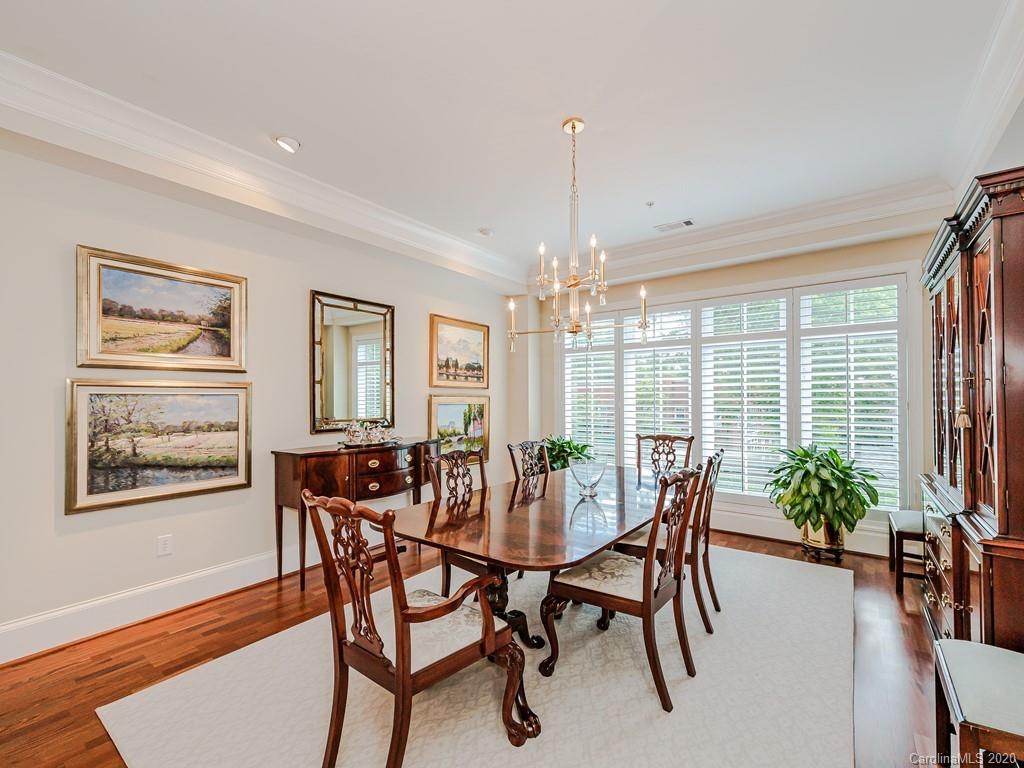 2223 Croydon Road, Unit 204 Charlotte, NC 28207 - Photo 7 of 27 a view of a dining room with furniture window and wooden floor